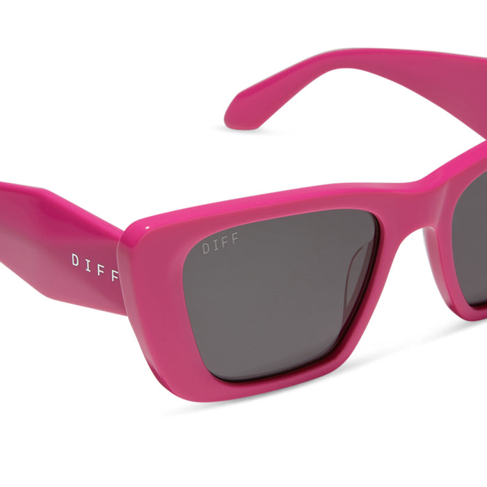 diff eyewear featuring the aura cat eye sunglasses with a bright pink frame and grey lenses detailed view