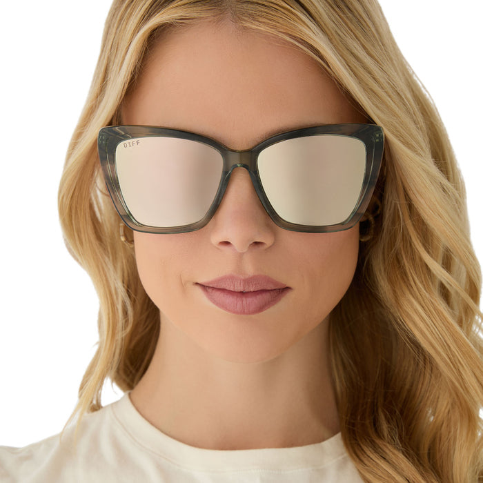 on model - female wearing diff eyewear featuring the becky ii cat eye sunglasses with a cool matcha green frame and cool matcha mirror lenses front view