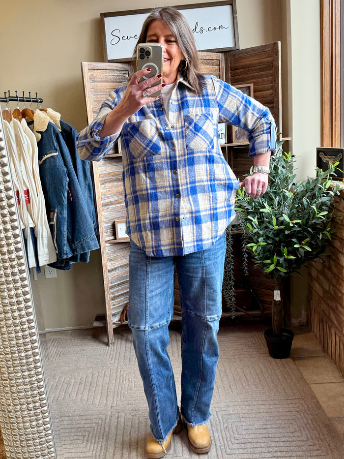 Blue plaid shacket with button-front, long sleeves, and chest-length fit
