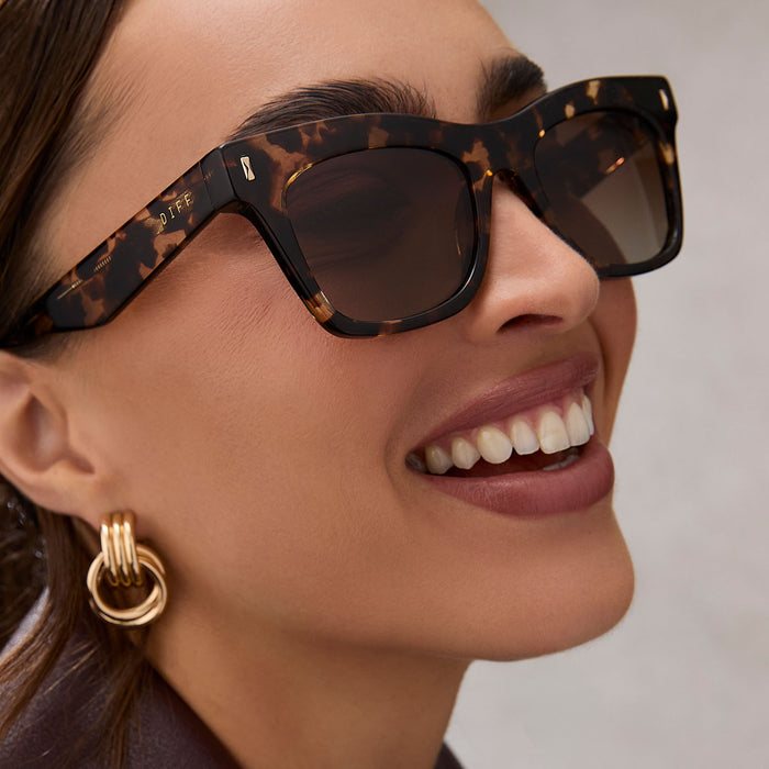on model - female wearing diff eyewear featuring the bradley cat eye sunglasses with a espresso tortoise frame and brown gradient polarized lenses side view