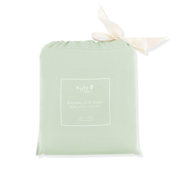 Crib Sheet in Basil shown in its packaging