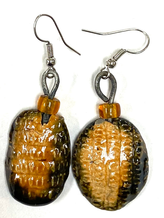 Shimmery two tone yellow orange luster textured amber bead 1/2 ounce