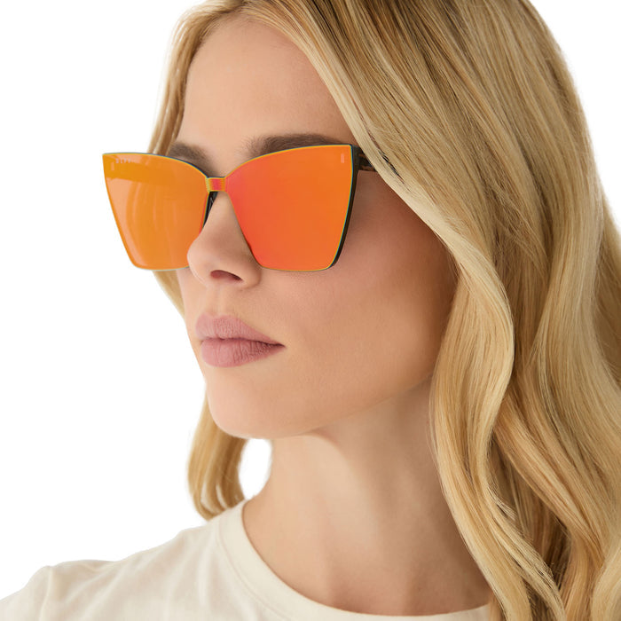 on model - female wearing diff eyewear featuring the goldie xs cat eye sunglasses with a animal print frame and red hot summer mirror lenses side view