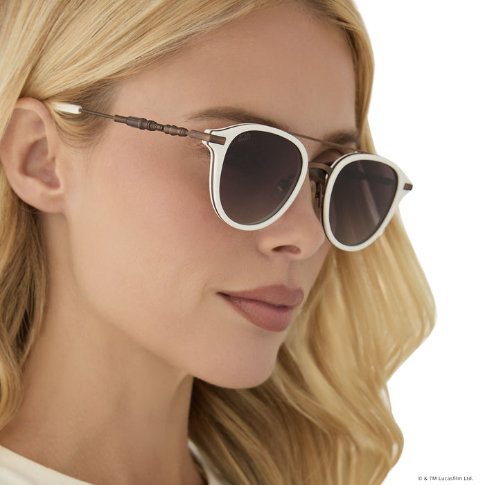 on model - female wearing star wars x diff eyewear featuring the rey™ round sunglasses with a off white + bronze frame and brown gradient polarized lenses side view of light saber temple