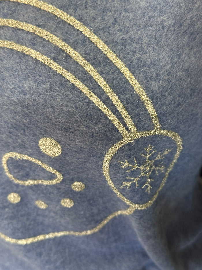 Blue sweatshirt with glitter snowman face graphic on chest