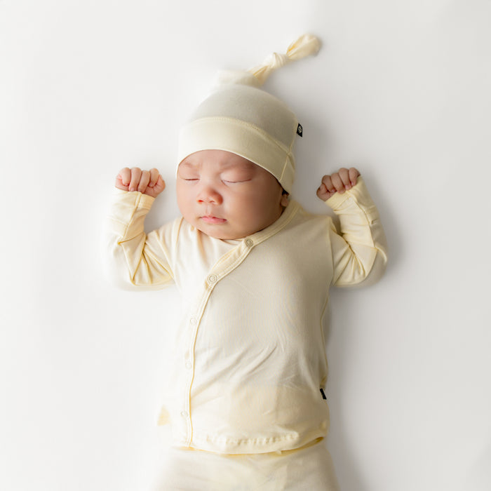 Close up of sleeping infant wearing the Take Me Home Set with Cap in Chamomile