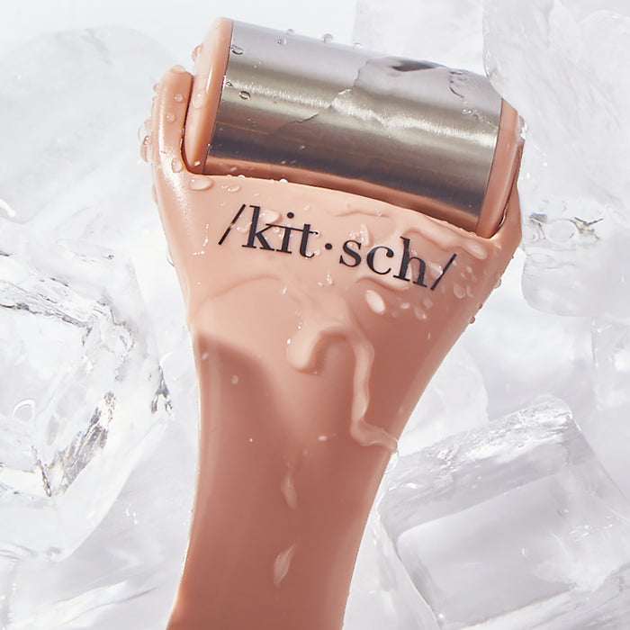 Terracotta Ice Roller shown with skincare products in morning routine flat lay