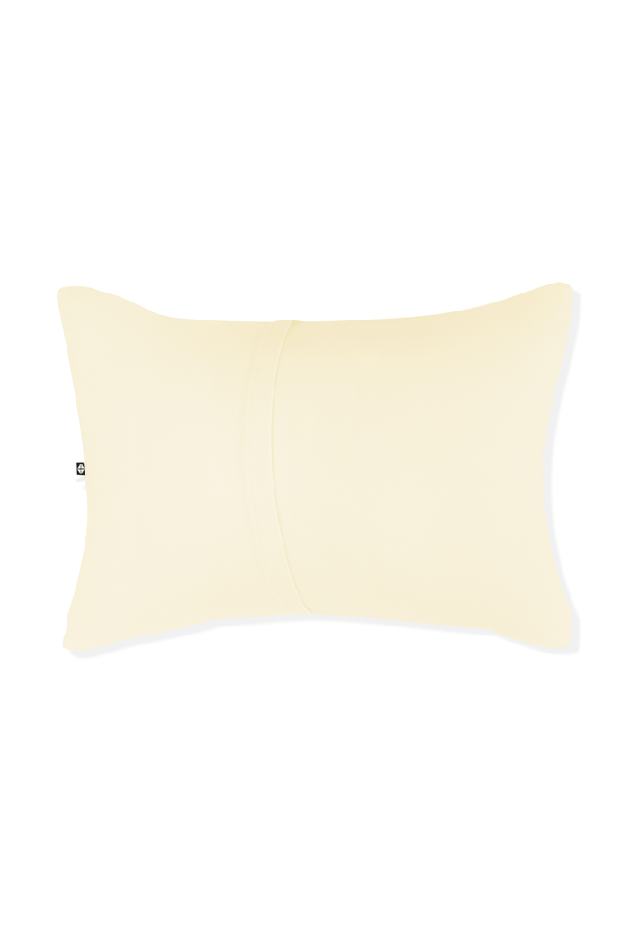 Yellow pillow with envelope closure on a white background