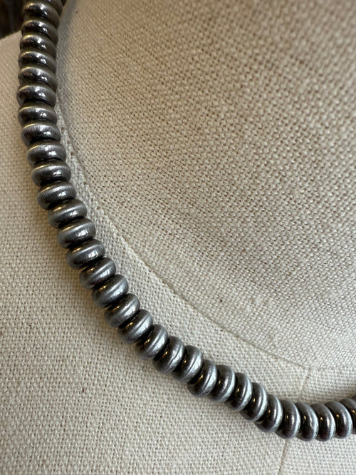 Silver-tone 6mm saucer beaded necklace chain, close-up.