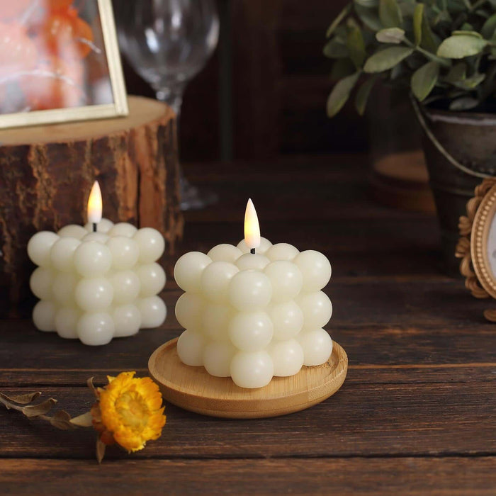 Decorative bubble candle on wooden tray with rustic background.
