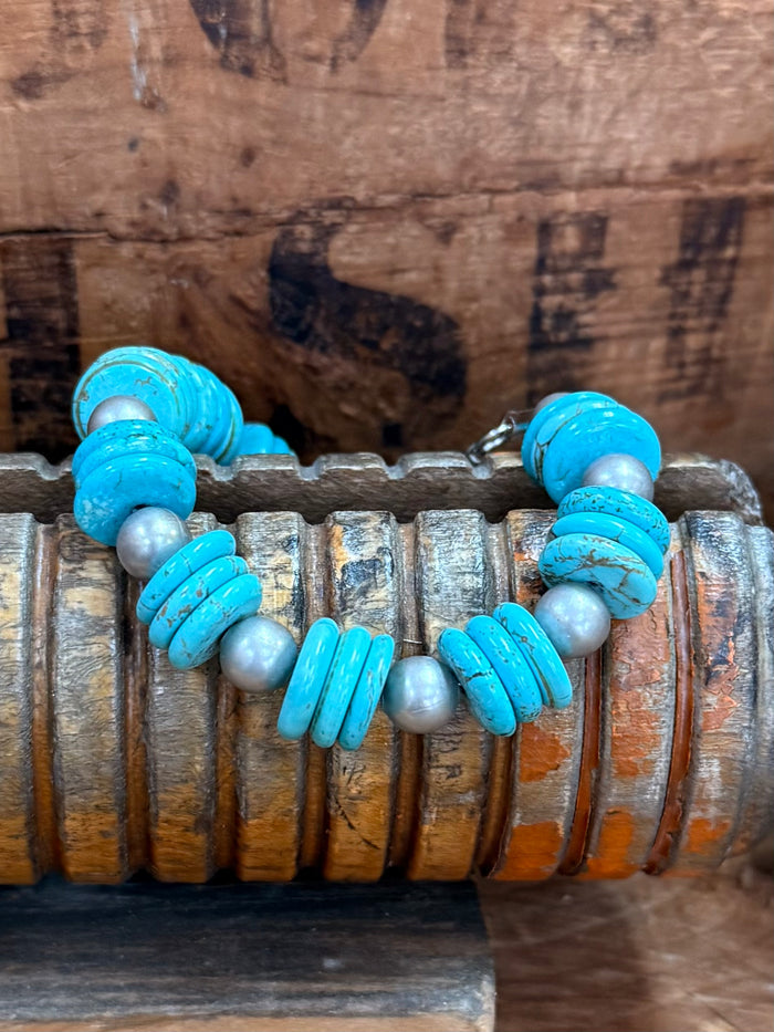 Turquoise and silver-tone bead bracelet with chunky blue barrel and round beads