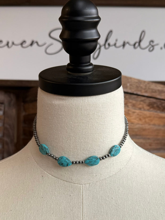 Turquoise stone bead choker necklace with dark chain and multiple oval stones