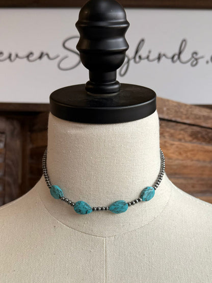 Turquoise stone bead choker necklace with dark chain and multiple oval stones