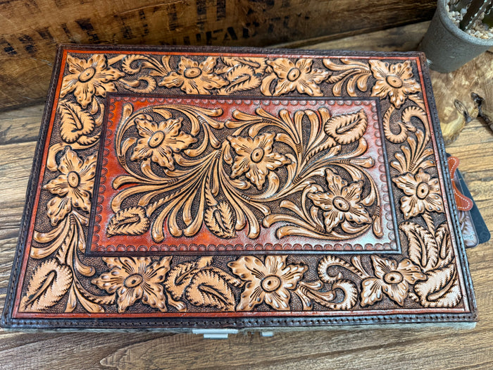 Rectangle hair-on jewelry box lid with ornate orange and tan hand-tooled floral pattern