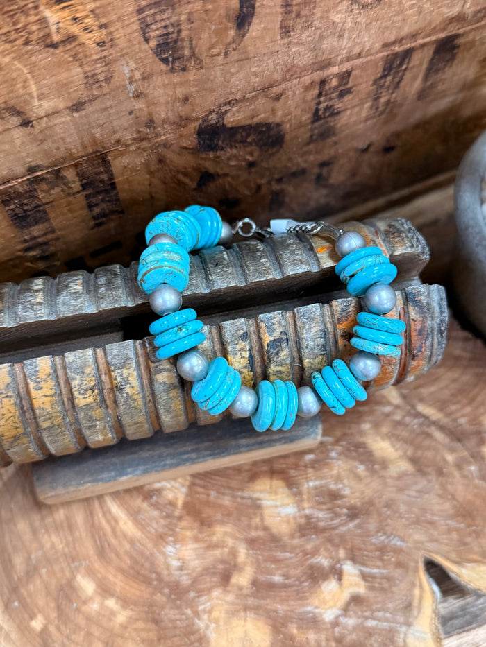 Turquoise beaded bracelet with silver-tone round beads and small metal clasp