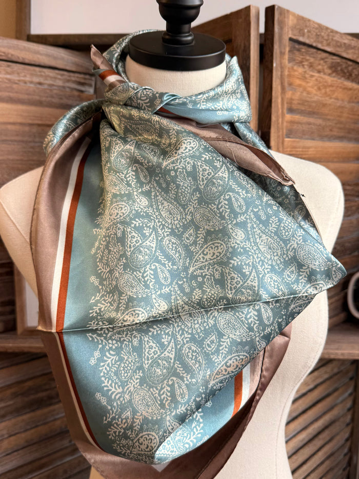 Teal paisley wild rag scarf with cream edge and tan stripe trim