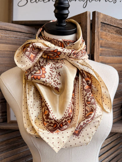 Cream wild rag scarf with orange-brown paisley medallions and dotted corners