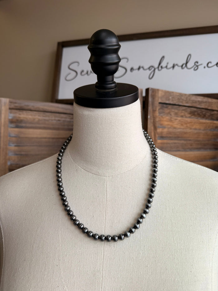Silver-toned beaded double-strand necklace with evenly spaced beads
