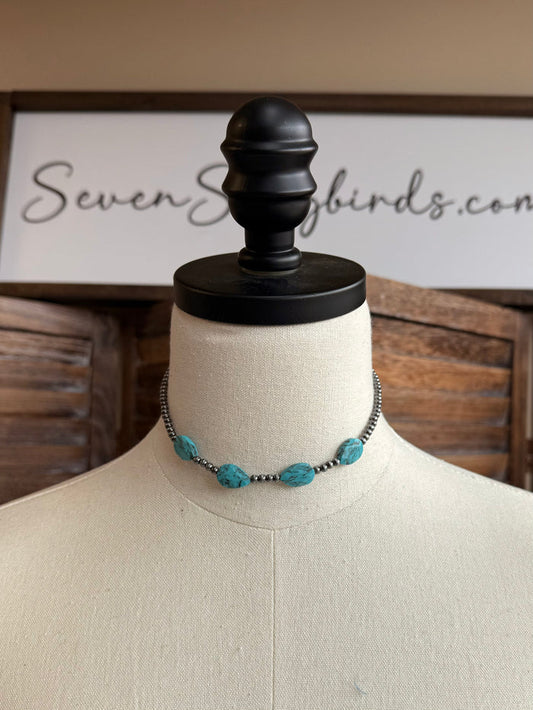 Turquoise stone bead choker necklace with dark chain and three oval beads