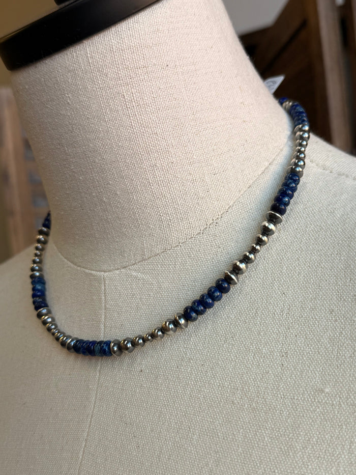 Close-up blue sea sediment jasper bead necklace with silver spacers