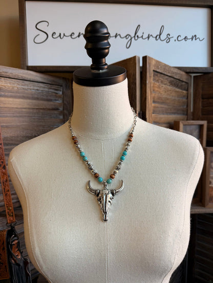 Beaded cow skull pendant necklace with turquoise and brown beads, silver-tone skull
