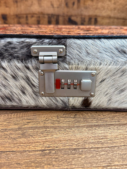 Rectangle hair-on jewelry box detail: metal lock plate with combination dials on gray fur