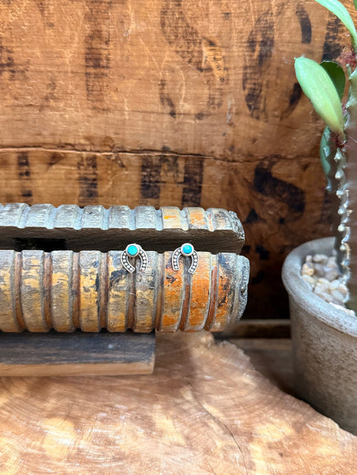 Sterling horseshoe stud earrings with turquoise round stones and silver detailing