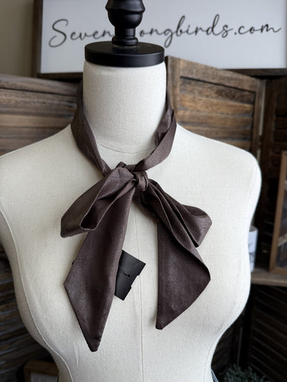 Chocolate brown leather twilly scarf with bow knot at neckline.