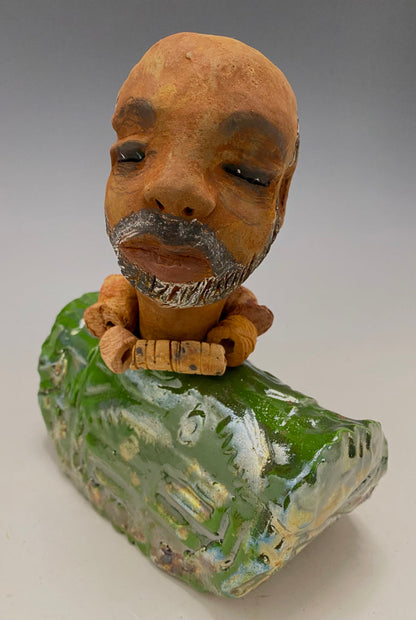 Learning to draw is really a matter of learning to see - to see correctly - and that means a good deal more than merely looking with the eye.- Lester Jones  Meet James! Albert stands 7.5" x 6" x 3" and weighs 2.5lbs. Albert wears a colorful metallic copper green dashiki. He is partially bald with a salt and peppered beard. Yes ,,,,,,He is one of few Men found in the Herdew collection!
