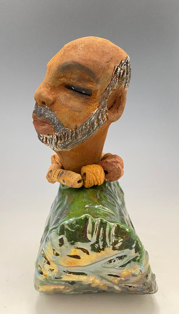 Learning to draw is really a matter of learning to see - to see correctly - and that means a good deal more than merely looking with the eye.- Lester Jones  Meet James! Albert stands 7.5" x 6" x 3" and weighs 2.5lbs. Albert wears a colorful metallic copper green dashiki. He is partially bald with a salt and peppered beard. Yes ,,,,,,He is one of few Men found in the Herdew collection!