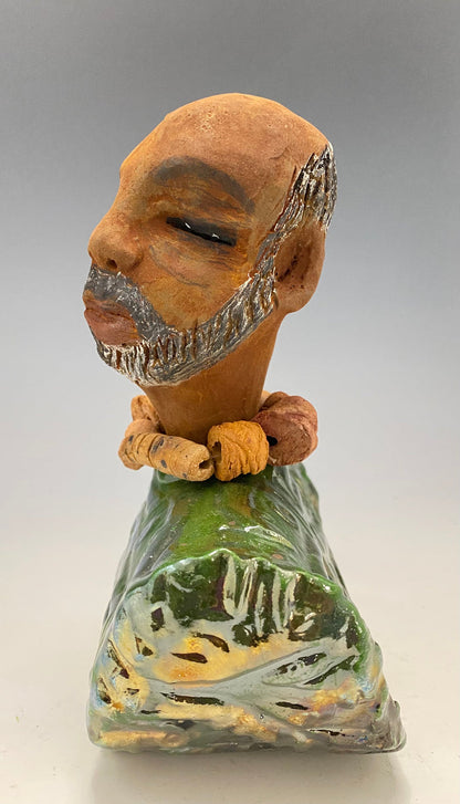 Learning to draw is really a matter of learning to see - to see correctly - and that means a good deal more than merely looking with the eye.- Lester Jones  Meet James! Albert stands 7.5" x 6" x 3" and weighs 2.5lbs. Albert wears a colorful metallic copper green dashiki. He is partially bald with a salt and peppered beard. Yes ,,,,,,He is one of few Men found in the Herdew collection!