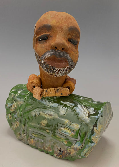 Learning to draw is really a matter of learning to see - to see correctly - and that means a good deal more than merely looking with the eye.- Lester Jones  Meet James! Albert stands 7.5" x 6" x 3" and weighs 2.5lbs. Albert wears a colorful metallic copper green dashiki. He is partially bald with a salt and peppered beard. Yes ,,,,,,He is one of few Men found in the Herdew collection!