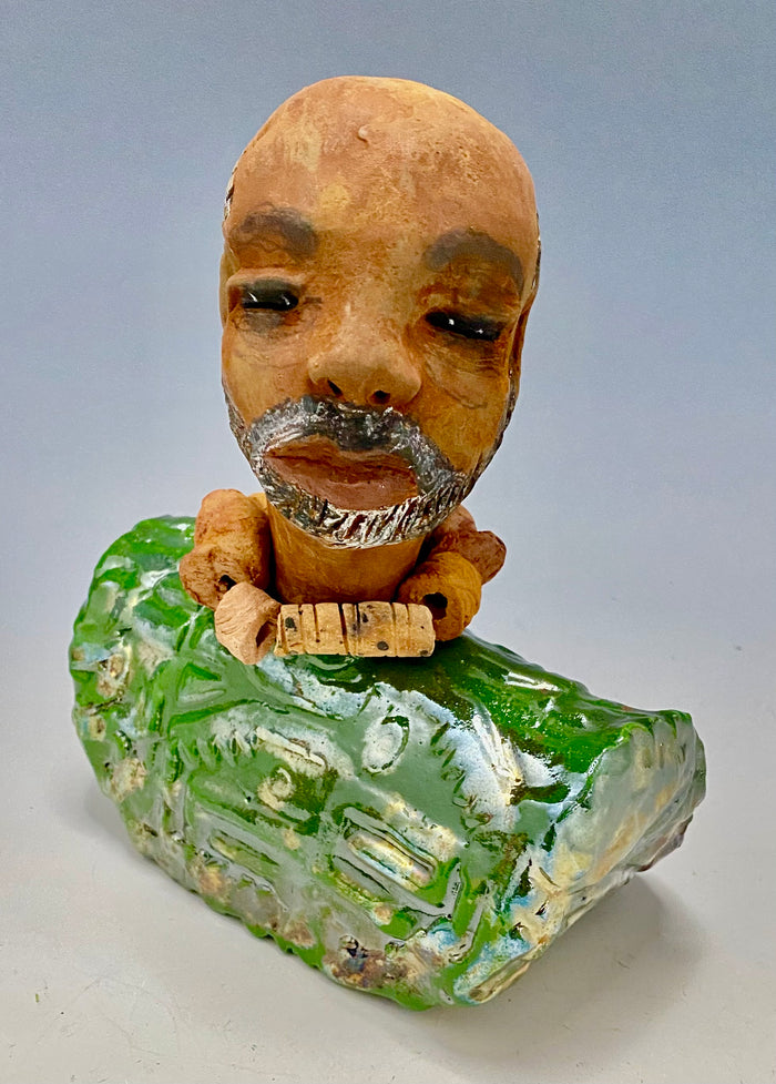 Learning to draw is really a matter of learning to see - to see correctly - and that means a good deal more than merely looking with the eye.- Lester Jones  Meet James! Albert stands 7.5" x 6" x 3" and weighs 2.5lbs. Albert wears a colorful metallic copper green dashiki. He is partially bald with a salt and peppered beard. Yes ,,,,,,He is one of few Men found in the Herdew collection!