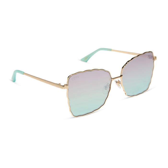 disney princess x diff eyewear featuring the ariel 2.0 sunglasses with a Shimmering Gold frame and Iridescent Sea Foam Pink To Blue Gradient Lenses angled view