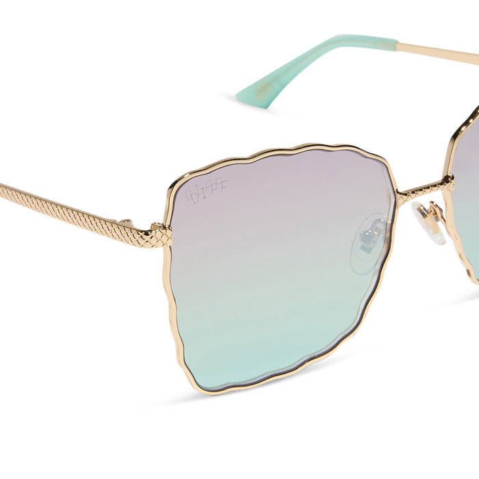 disney princess x diff eyewear featuring the ariel 2.0 sunglasses with a Shimmering Gold frame and Iridescent Sea Foam Pink To Blue Gradient Lenses detailed view
