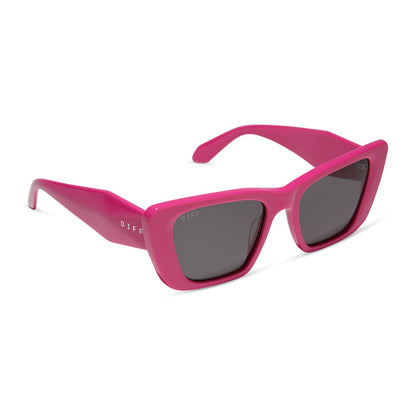 diff eyewear featuring the aura cat eye sunglasses with a bright pink frame and grey lenses angled view