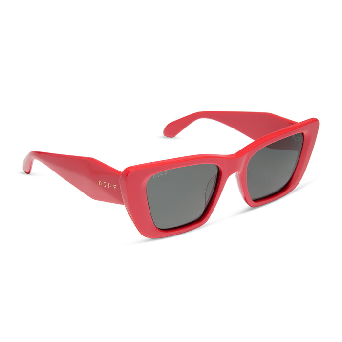 diff eyewear aura square sunglasses with a sunset red frame and grey polarized lenses angled view