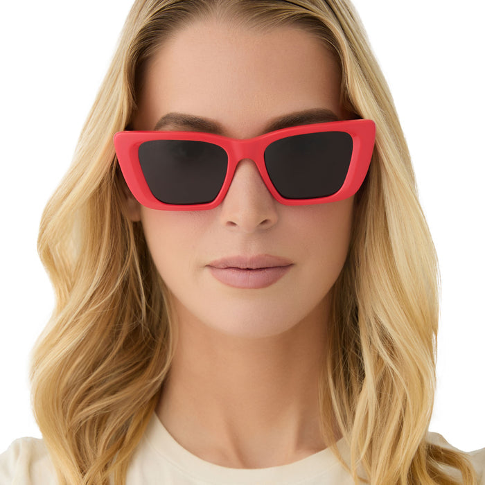 on model - female wearing diff eyewear aura square sunglasses with a sunset red frame and grey polarized lenses front view