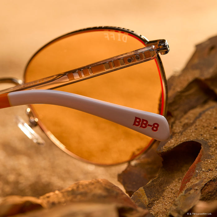 still life - resting on a rock star wars x diff eyewear featuring the bb-8™ round sunglasses with a droid white with silver frame and orange lenses detailed temple view