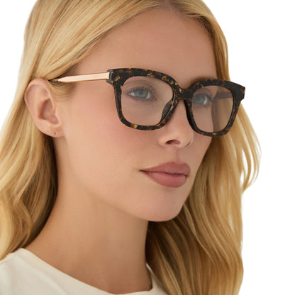 on model - blonde female wearing diff eyewear bella xs square glasses with a glitter tortoise frame angled view