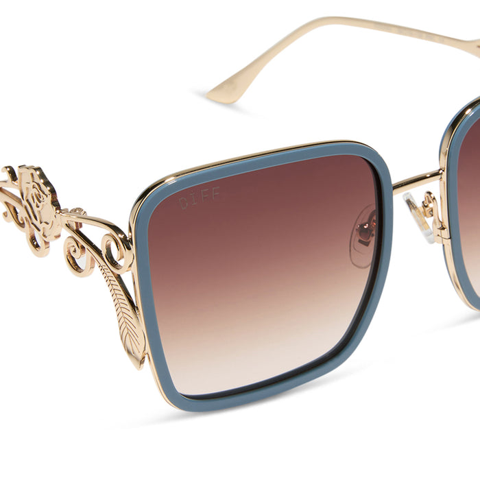 disney princess x diff eyewear featuring the belle 2.0 oversized square sunglasses with a gold and enchanting blue frame with brown gradient polarized lenses detailed view
