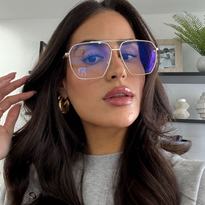 lifestyle - rachel boniske wearing gold wire frame eyeglasses