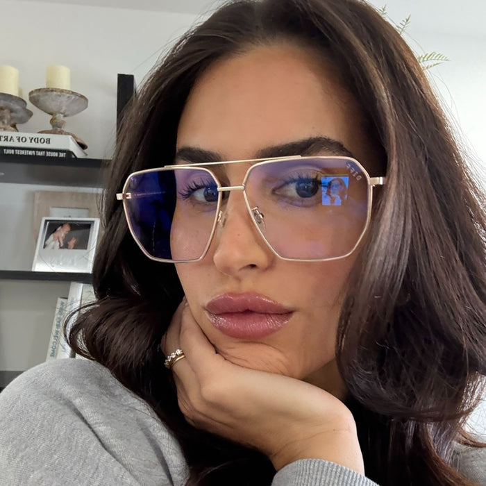 lifestyle - rachel boniske wearing gold wire frame eyeglasses
