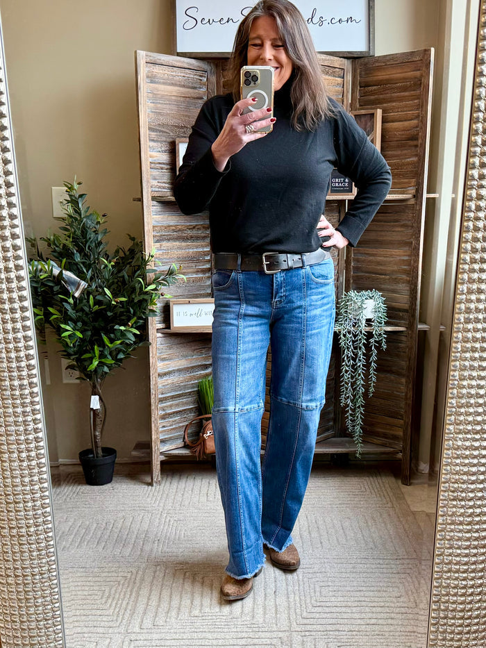 Black fitted turtleneck sweater with long sleeves