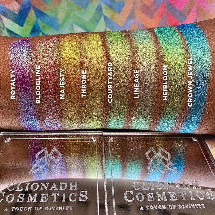 Top angled arm swatches on deep skin tone of Bloodline Vibrant Multichrome Eyeshadow shifts in Vibrant Multichrome Eyeshadow Bundle with Royalty, Majesty, Throne, Courtyard, Lineage, Heirloom, Crown Jewel