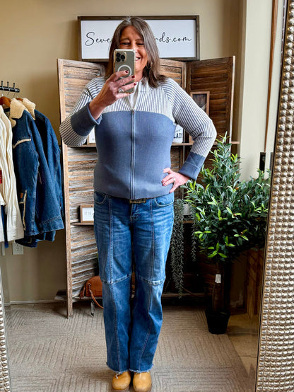 Blue ribbed zip-front fitted cardigan sweater with long sleeves and straight hem