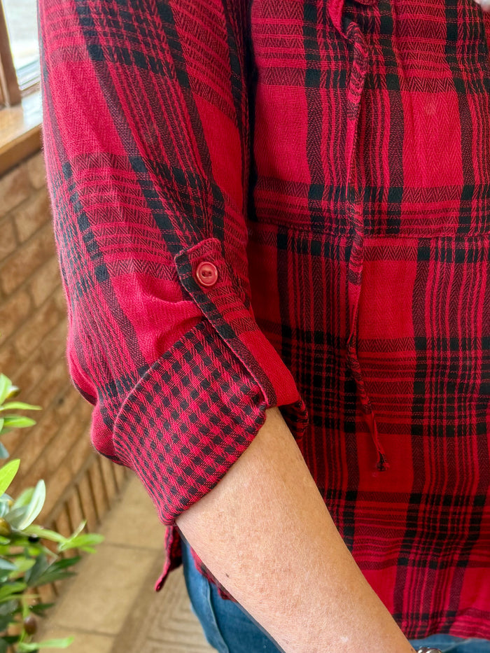 Red and black buffalo-plaid cotton shirt sleeve with button cuff
