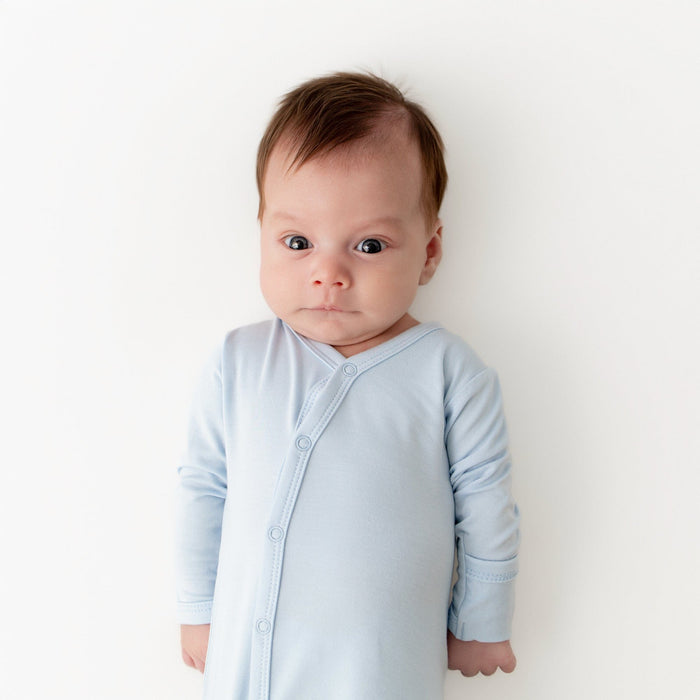 Close up of newborn wearing the Bundler in Breeze