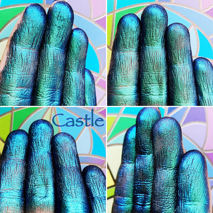 Finger swatches of Castle Jewelled Multichrome Eyeshadow angle shifts teal-blue-indigo