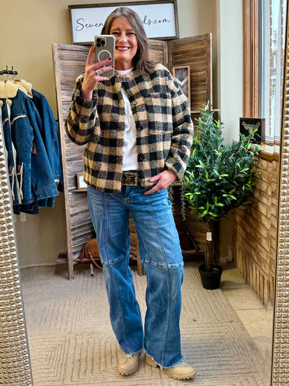 Black and tan checkered sherpa coat with button front and relaxed fit, side pockets